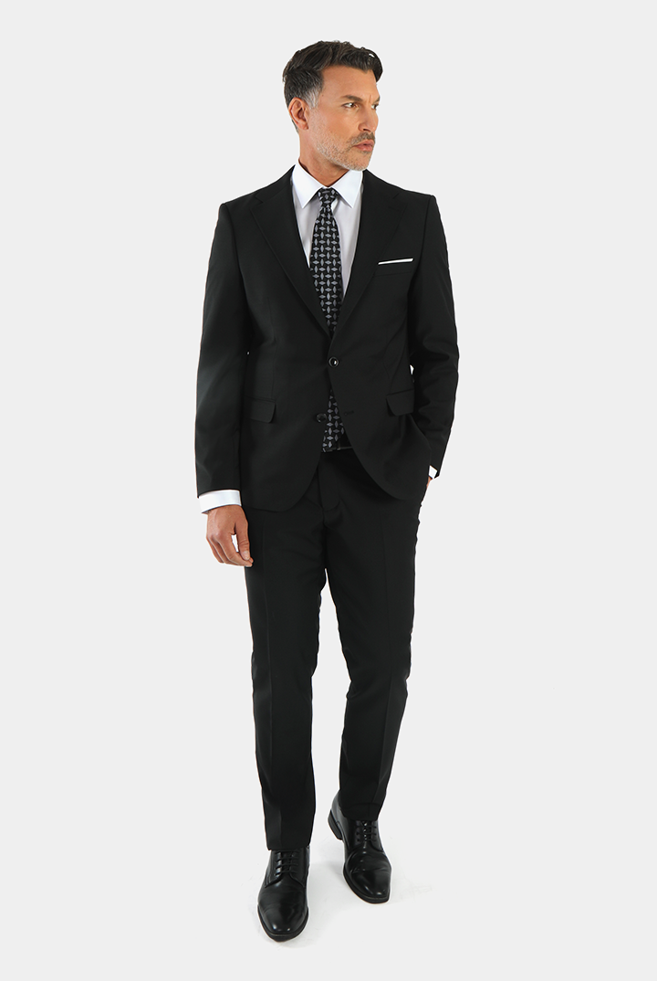 alt="DKS black slim solid formal suit front view with two button jacket"