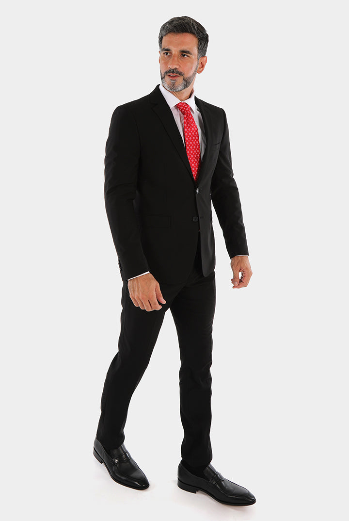alt="Mosaique black slim solid formal suit front view on model"