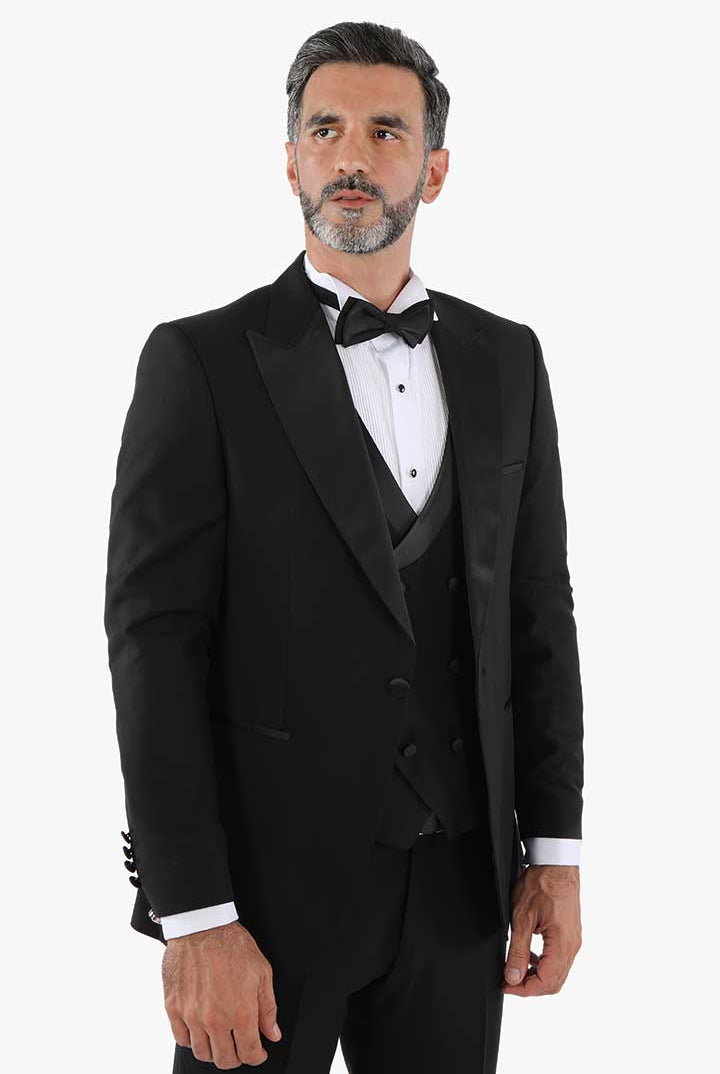 alt="DKS black slim solid tuxedo suit with vest front close view"