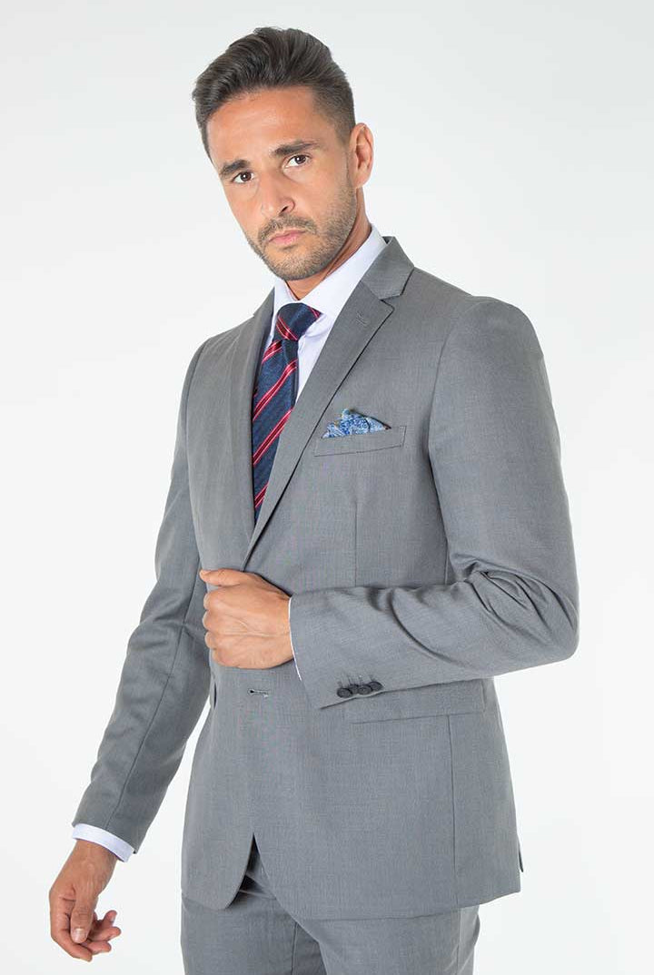 alt="Mosaique grey slim self designed formal suit side view on model"