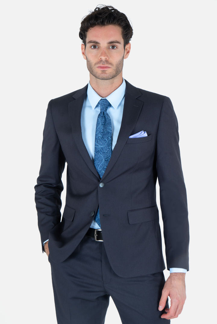 alt="Francisco Tolli charcoal slim plain formal suit front close view on model"