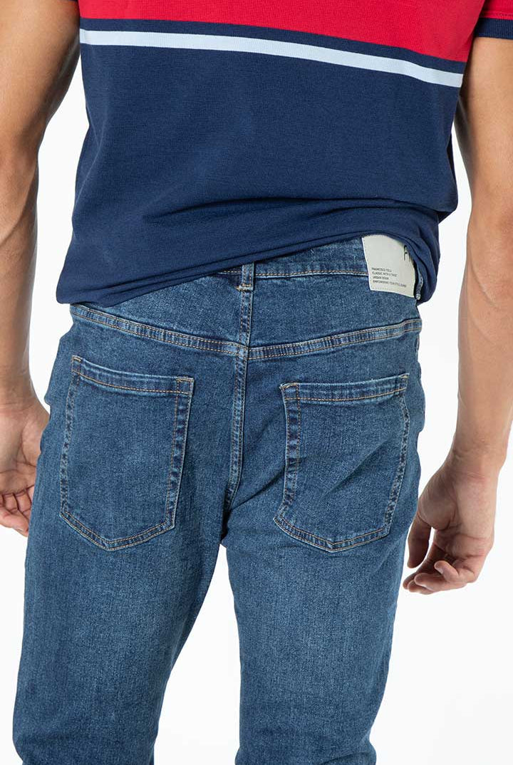alt="Francisco Tolli navy blue carrot denim jeans back view"