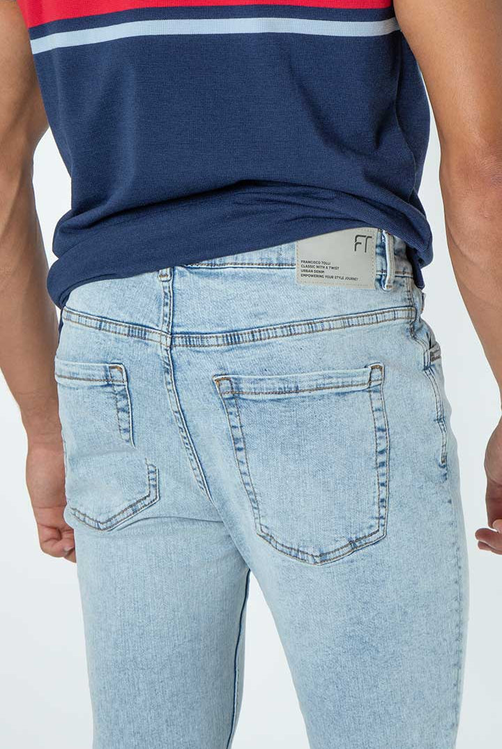 alt="Francisco Tolli light blue carrot denim jeans back view"