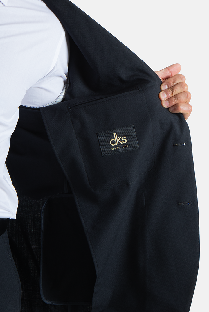 alt="DKS black slim fit fresco formal suit inner pocket and lining detail"