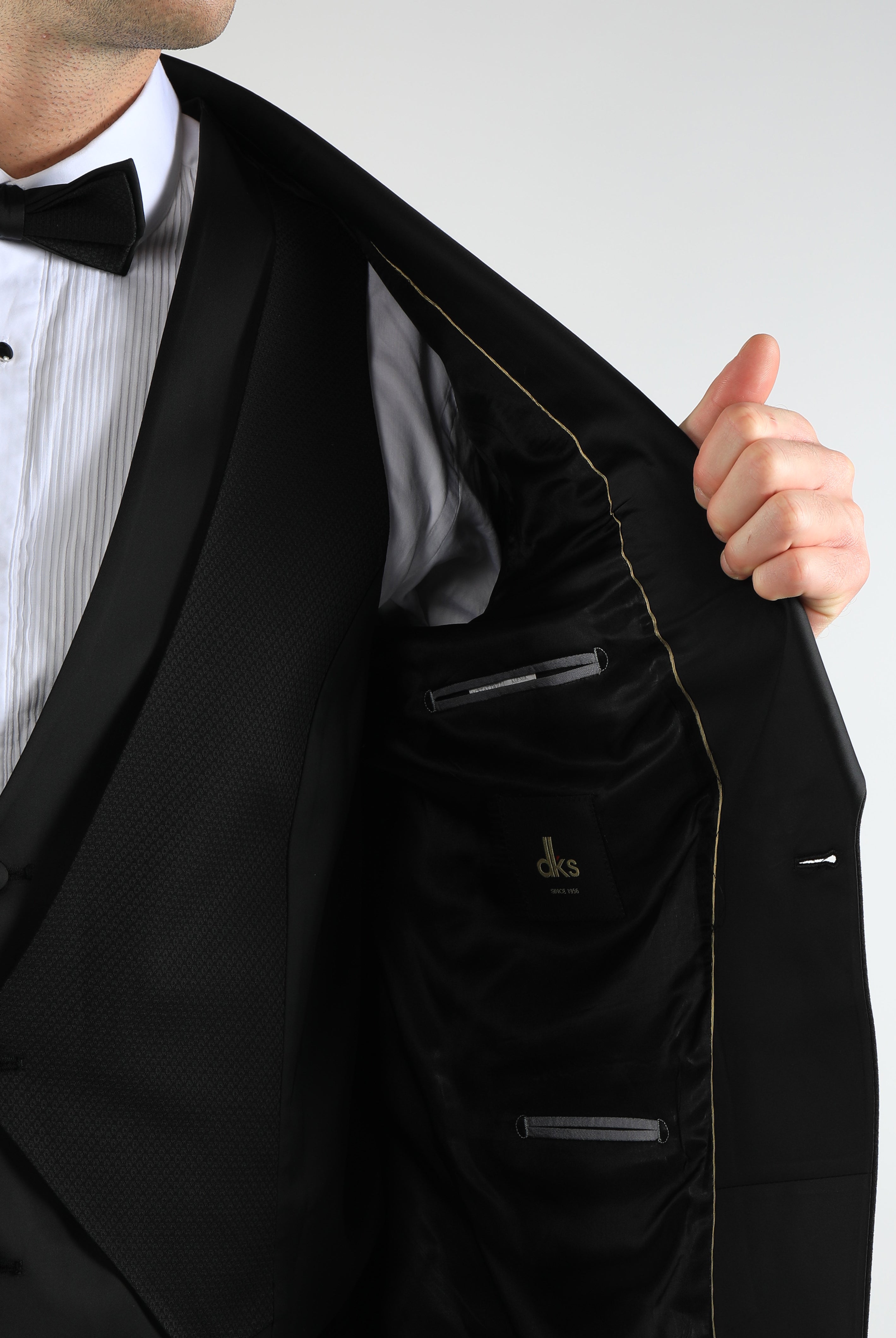 alt="DKS black slim tuxedo suit inner pocket and lining detail"