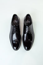 alt="DKS regular tuxedo shoe black patent leather top view"