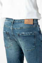 alt="Jack Morgan blue slim straight denim jeans 5 pocket back view"