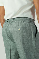 alt="Jack Morgan greenish grey slim fresco trouser formal with extended tab closure back view"